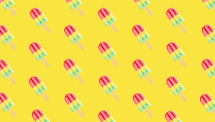 Colorful Ice cream popsicle pattern on pastel yellow background. Minimal summer concept. Flat lay.