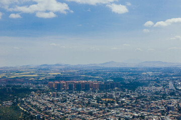 Fototapeta na wymiar Panoramic View to the African Capital Addis Ababa from the Airplane Window, Ethiopia