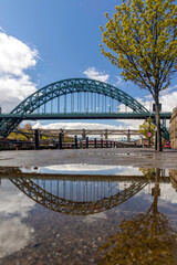 A general reflection view of the Tyne Bridge over the River Tyne in Newcastle upon Tyne, England