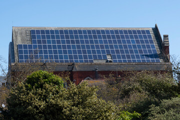 Large set of solar panels on roof of church