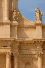 details of sculptures and statues of the Cathedral of Noto which is a jewel of Baroque architecture with its golden stone.