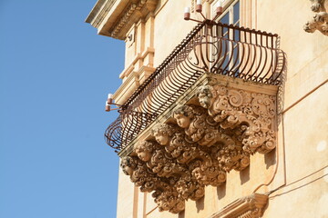 Palazzo Nicolaci is one of the main examples of Sicilian Baroque. The balconies with curved iron railings, corbels in carved stone with grotesque figures. © aliberti
