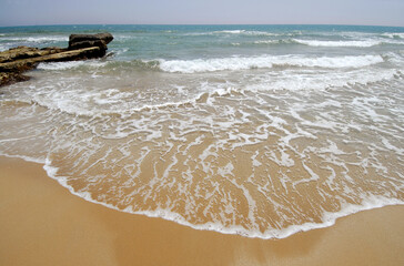 The beauty of the sea in winter, silences and scents of the Mediterranean sea on the beach of Noto...