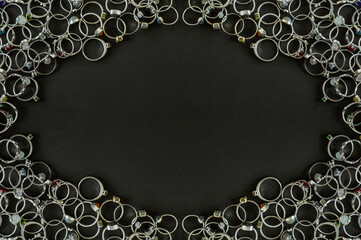 Dark gray jewelry banner. Silver rings with handmade gemstones.