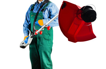 Isolated photo of worker in green overalls holding electric garden trimmer on white background.