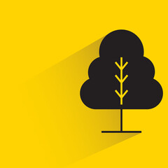 tree with shadow on yellow background