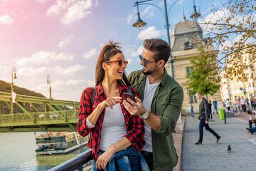A traveling couple being happy in the city - 436024331