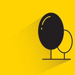 tree with shadow on yellow background