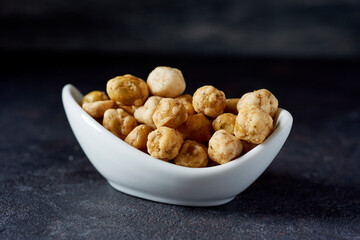 crispy roasted peas in a white bowl