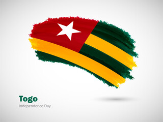 Happy independence day of Togo with artistic watercolor country flag background. Grunge brush flag illustration