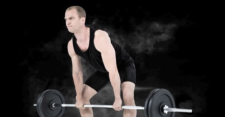 Fototapeta na wymiar Composition of caucasian male weightlifter with barbell with smoke on black background
