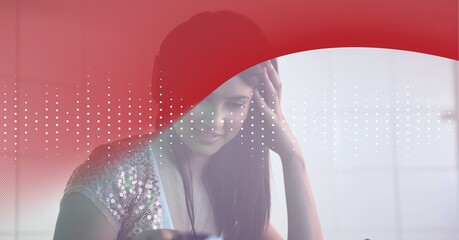 Composition of sound frequency dot level meters on red curve over smiling woman in headphones