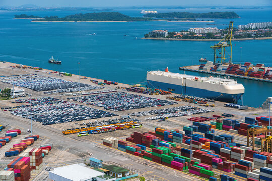 Car Carrier And Lined Up Import/Export Cars At The Sea Terminal.