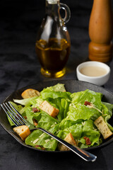 Caesar salad with croutons and bacon.
