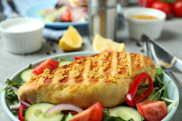 Tasty salad with grilled chicken, close up