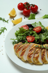 Concept of tasty eating with salad with grilled chicken on white background