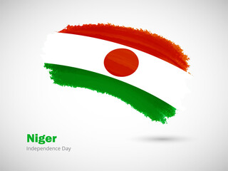 Happy independence day of Niger with artistic watercolor country flag background. Grunge brush flag illustration