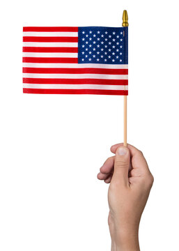 American Flag in man hand. 4th of July Independence Day. US starry striped patriotic symbol. United States of America. Flag on white isolated background. Macro Close-up High resolution photo.