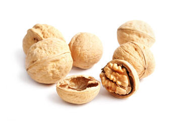 A few walnuts are isolated on a white background. Nut Macro concept.
