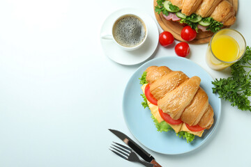 Concept of tasty eating with croissant sandwich, space for text
