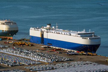 Anchored car carriers and imported cars.