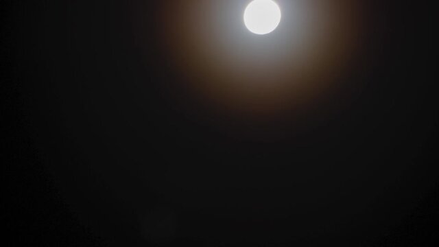 bright full moon. fullmoon night with beautiful shiny light around the round white bright moon.