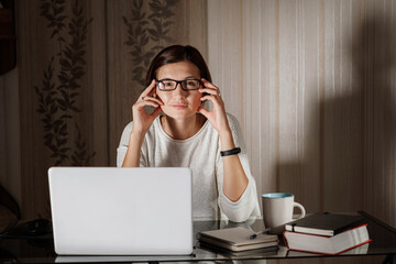 female student freelancer working at home on a task