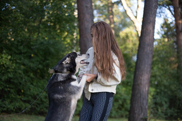 the girl is very happy with the dog