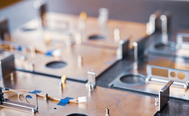 Metal boards and accessories lie on the surface