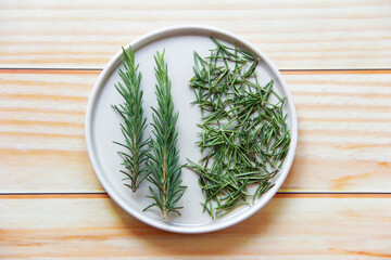 sprigs of spicy herb rosemary with sharp leaves