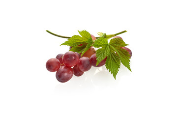 Ripe red grape. Bunch with leaves isolated on white background