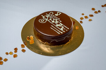 Round chocolate cake with musical notes on the top