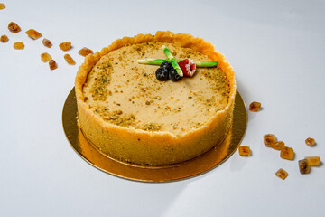 Sweet round cheesecake with asparagus and olives imitation on top