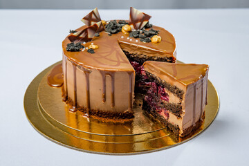 Round coffee and chocolate cake with berry filling