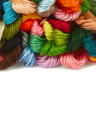 A set of multicolored threads for embroidery isolated on white bacground