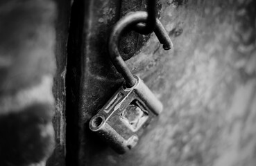 Metal open lock hangs on the door handle.