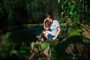 Woman resting at mountain lake in summer