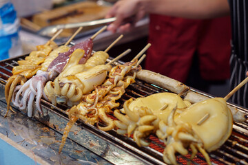Grilled squid on a charcoal grill