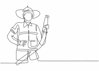 Continuous one line drawing of young male firefighter holding water nozzle. Professional job profession minimalist concept. Single line draw design vector graphic illustration