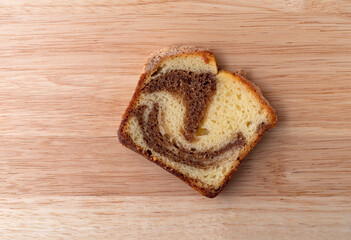 Fototapeta na wymiar Overhead view of a slice of a freshly baked cinnamon marble pound cake