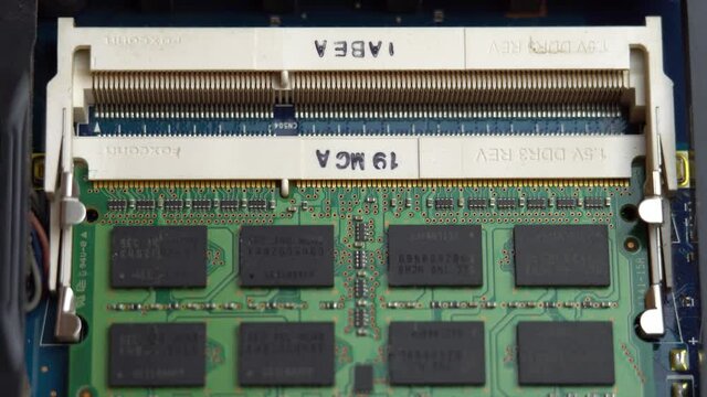 Inserting RAM into a laptop connector, laptop repair and maintenance at home