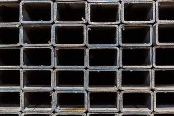 Background of metal profile pipe of rectangular cross section