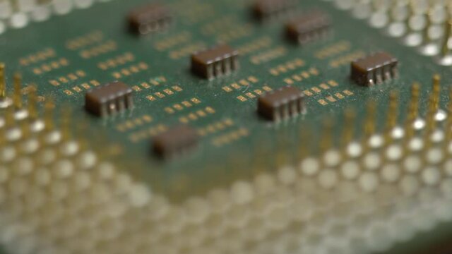 Broken computer processor with bent pins, used cpu close-up