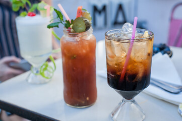 colorfull cocktails with small delicious appetizer in a high-class coctail bar 