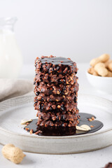 Chocolate cookies with peanuts poured with chocolate topping.  Sweets, still life, copy space.