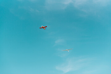Airplane Towing a Glider Across the Blue Sky