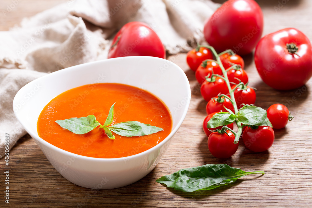 Sticker plate of tomato soup with basil