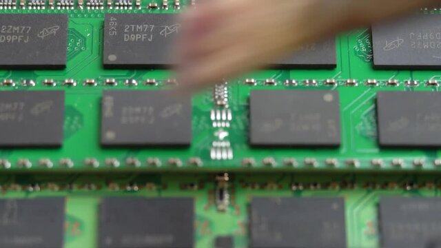 Removing dust from laptop RAM with a brush, cleaning laptop parts