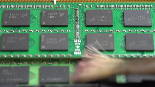 Removing dust from laptop RAM with a brush, cleaning laptop parts