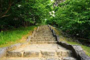 Obraz premium Aerial view of Nakijinjo castle ruins and the stone wall in Okinawa, Japan - 日本 沖縄 今帰仁城跡 城壁